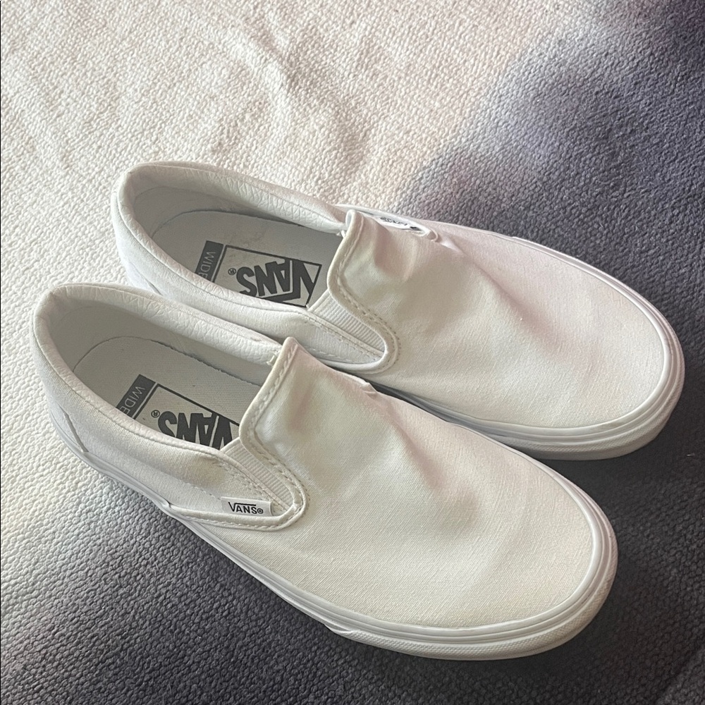 Vans women’s Classic White Slip-On Sneakers